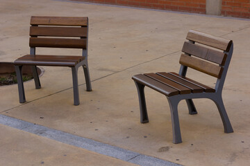Fototapeta na wymiar Empty chair in urban environment
