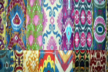 background with samples of satin and silk fabric with Uzbekistan national pattern