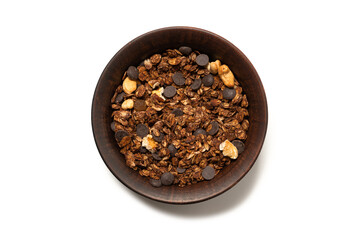 Chocolate granola cereal with nuts in a bowl background.