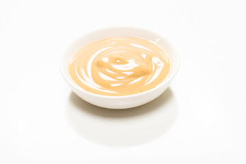 Mushroom sauce in a bowl isolated on white background.