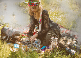 Gypsy soul... Boho woman with Tarot cards, candles and magic ball at field, lifestyle, predicting, ideas for costume on Halloween © T.Den_Team