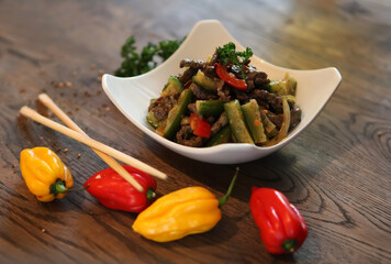 Salad with cucumbers. peppers and beef. Spicy Korean-style salad.