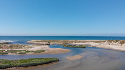 DRONE AERIAL VIEW: The mouth and estuary of Neiva River in Castelo do Neiva, Viana do Castelo, Portugal.