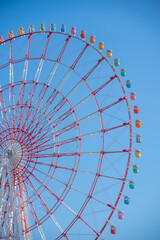 Rainbow Ferris Wheel with Blue Sky