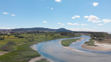 DRONE AERIAL VIEW: The mouth and estuary of Neiva River in Castelo do Neiva, Viana do Castelo, Portugal.