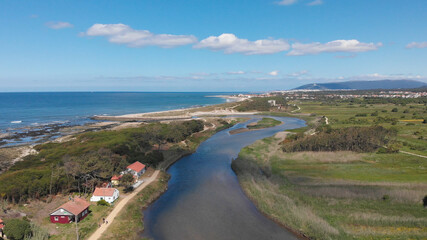 Fototapeta na wymiar DRONE AERIAL VIEW: The mouth and estuary of Neiva River in Castelo do Neiva, Viana do Castelo, Portugal.
