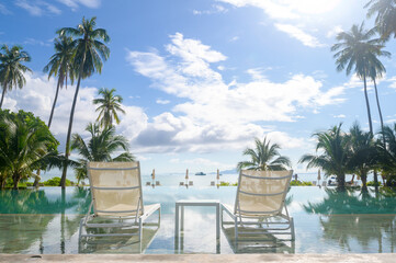 Beautiful view of swimming pool with Green tropical garden in cozy resort, phi phi island, Thailand