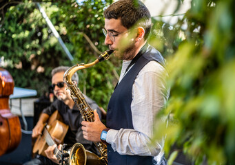 Man playing saxophone while performing at event