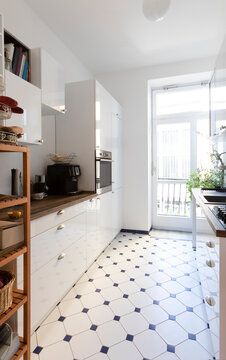 Modern Kitchen With Patterned Flooring At Home