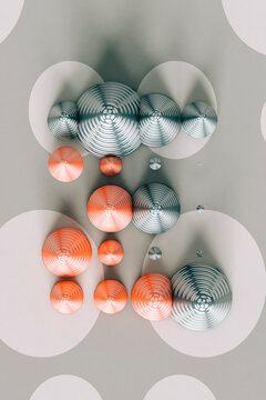 Three dimensional render of red and gray cones laid on polka dot pattern