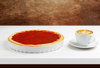 Homemade cheesecake with berries topping and cup of coffee cappuccino on white wooden table. Copyspace.