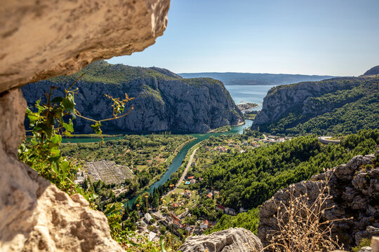Croatia, Dalmatia, Omis, Settlement situated at forested bank of Cetina river in summer