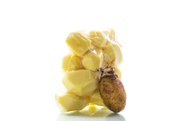 peeled potatoes closed in a vacuum bag and old sprouted potatoes