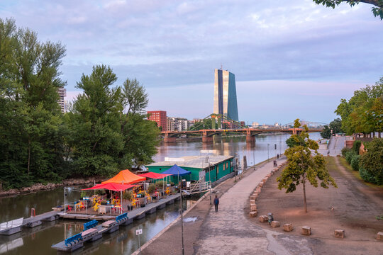 View of the Main river at night with European Central Bank, Ignatz Bubis and Flossen bridge, Frankfurt, Germany