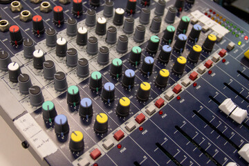 Fototapeta premium Close up of a music sound mixer at an outdoor, indoor event. 