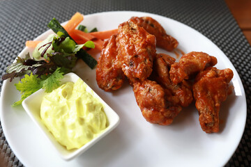 Fried chicken wings with sauce