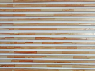 Polished narrow boards nailed to the wall