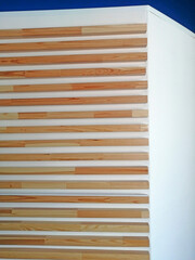 Polished narrow boards nailed to the wall