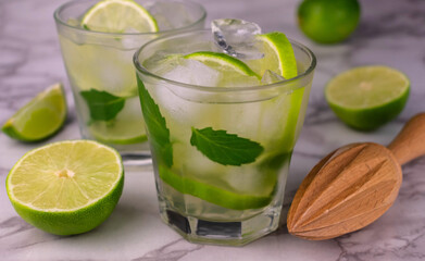 
Two refreshing mozhito on a white background. Selective focus.