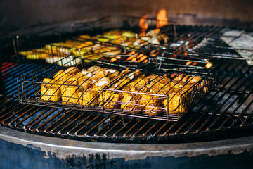 Cooking vegetables on the grill in the kitchen at the restaurant