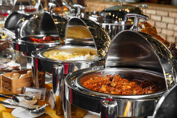 Different food buffet catering dishes in steel bain-maries - obrazy, fototapety, plakaty