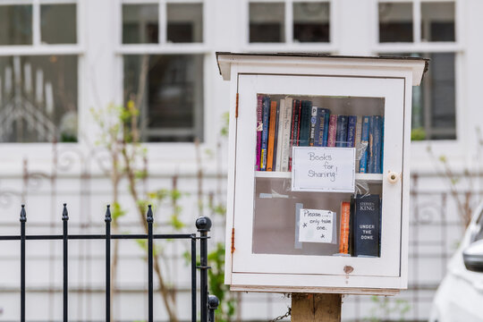 A free book exchange box on a residential  street.