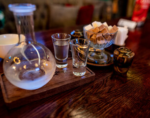 still life with food and drinks on a table in a restaurant 