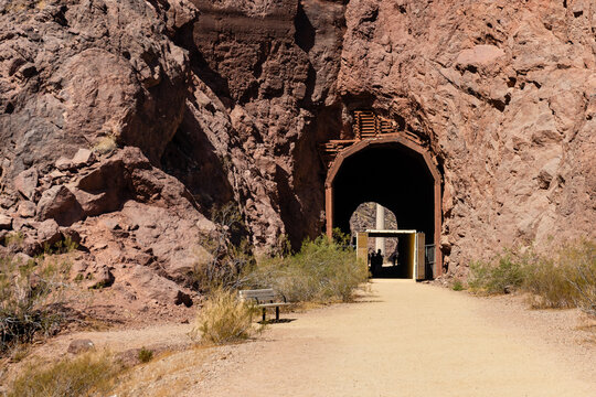 The Hoover Dam Historic Railroad Trail near Boulder City, Nevada passes through a shipping container in a tunnel to protect hikers from falling rock
