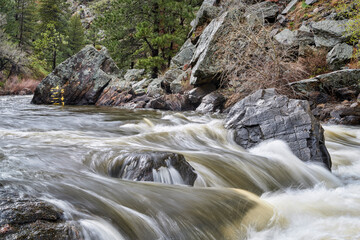 river gauge for kayakers and rafters on the Poudre River below Poudre Park, spring scenery with a high flow © MarekPhotoDesign.com