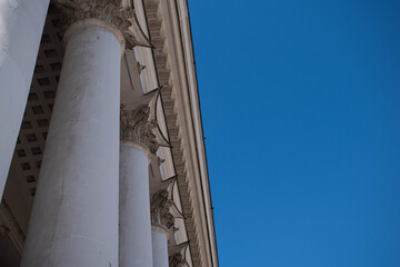 Columns. This photo can be used to show an example of ancient structures, to show the contrast of buildings and the bright blue sky. It will be the perfect background for your desktop.