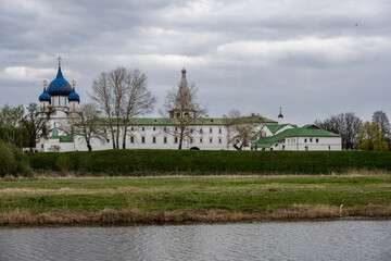 city views of the old kremlin churches and the monastery of the city of Suzdal during the rain