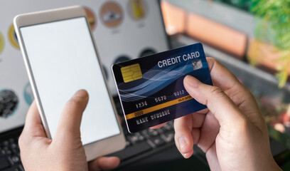 Mockup smart phone image. White screen. Women holding credit card and using mobile phone. Online shopping concept.