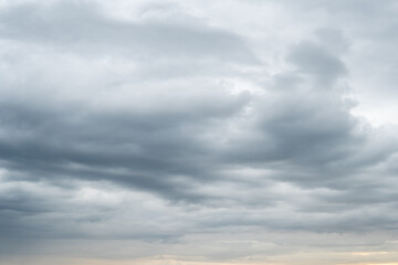 Beautiful sunset sky with contrasted clouds. Summertime on the Swedish west coast.
