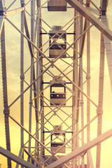 Fototapeta na wymiar Ferris wheel, side view. Ferris wheel booths against the sky. Ferris wheel, view from the booth