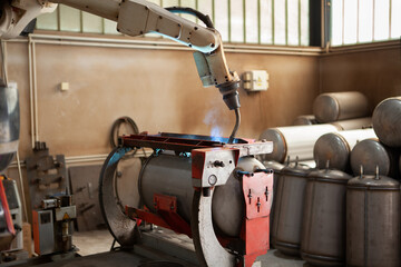 Automated industry process, machine welding, worker robotic arm welding inox boiler with argon gas