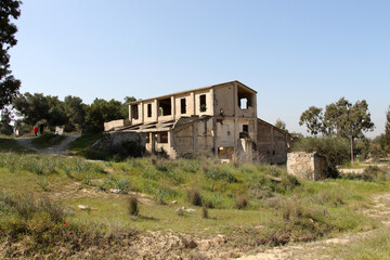 Fototapeta na wymiar The remains of a sulfur distillation plant established in 1933 stand outside of Kibbutz Beeri, in Israel