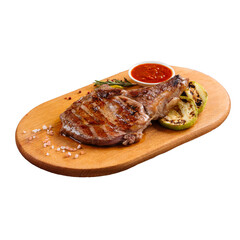 Isolated portion of grilled juicy steak with squash and sauce
