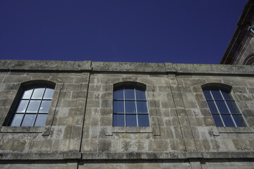 the windows of a building. photo during the day.
