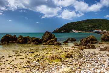 Portinho da Arr&aacute;bida is a well kept secret with beautiful surroundings where you can find a nice beach with calm waters and very nice fish restaurants