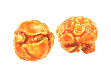 Sweet caramel candy popcorn pieces isolated on a white background, macro.