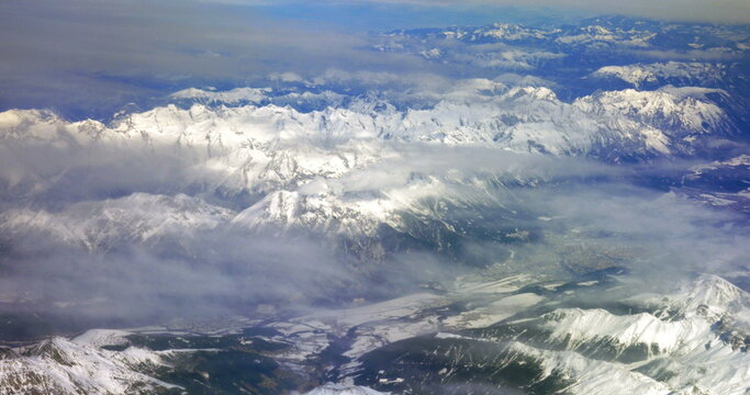 Flying over the snowy mountains © danr13