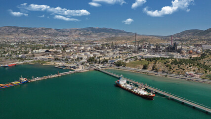 Fototapeta na wymiar Aerial drone photo of industrial public Hellenic Petroleum refinery in area and bay of Aspropirgos, Attica, Greece