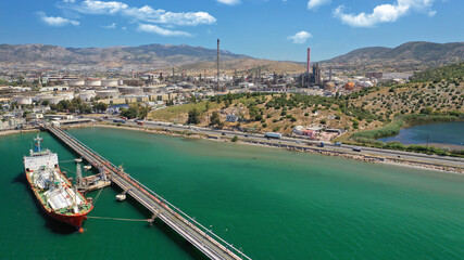 Aerial drone photo of industrial public Hellenic Petroleum refinery in area and bay of Aspropirgos,...