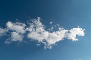 White fluffy cloud against blue sky, weather and nature photography 

