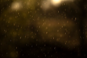 Raindrops in the air, natural dark background