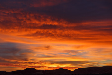 Colorful sky during sunset in the Sahara Desert. Morocco. Beautiful red sky.