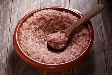 Himalayan salt, pink, in a red ceramic bowl