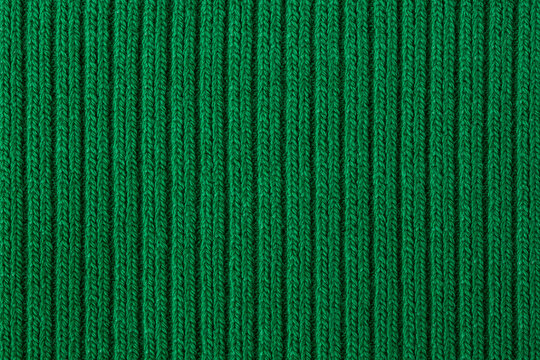Knitted texture green close up, background