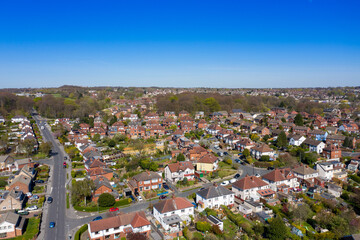 Fototapeta na wymiar Aerial photo of the British town of Meanwood in Leeds West Yorkshire showing typical UK housing estates and rows of houses from above in the spring time on a sunny day