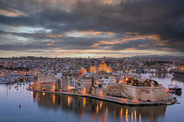 Illuminated skyline of Senglea at twiligh sunset,Malta
